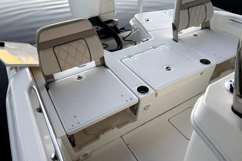 Slide: The Image of 2022 Boston Whaler 250 Dauntless boat interior with seating and storage compartments. - 17