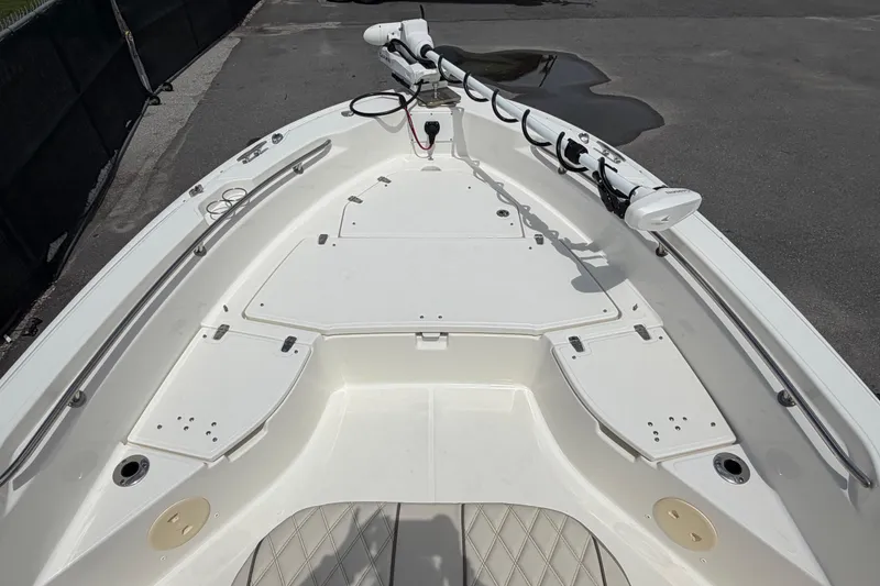 Slide: The Image of 2022 Boston Whaler 250 Dauntless boat deck with storage compartments and mounted equipment. - 29