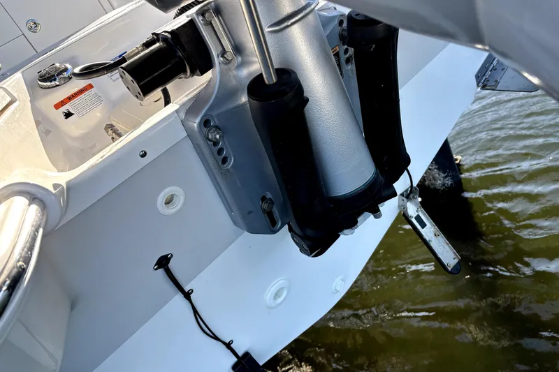 Slide: The Image of Close-up of 2022 Boston Whaler 250 Dauntless boat engine and transom in water. - 19