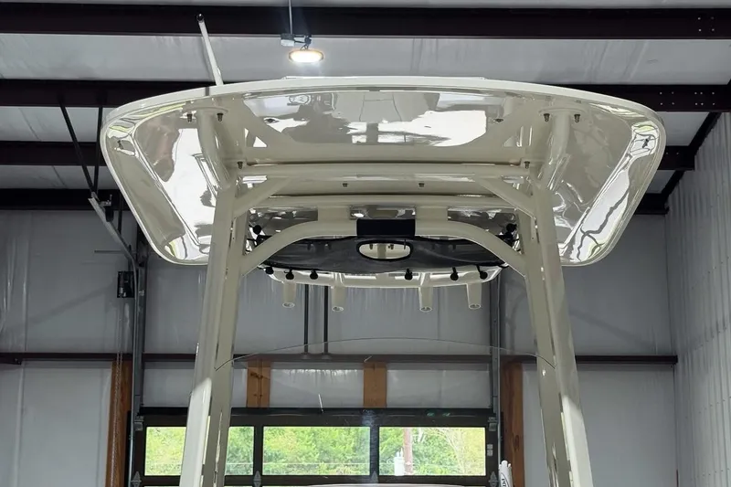 Slide: The Image of 2022 Boston Whaler 250 Dauntless boat top view in a garage setting. - 16
