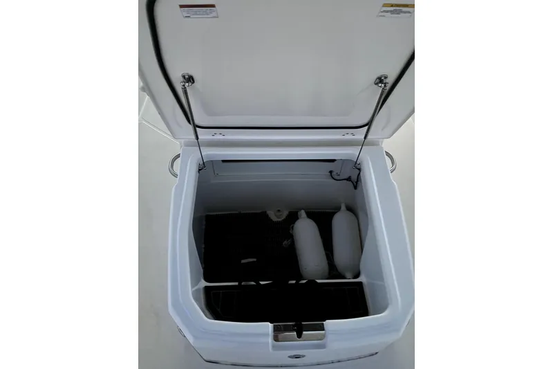 Slide: The Image of Open storage compartment on 2022 Boston Whaler 250 Dauntless boat, showing interior space. - 41