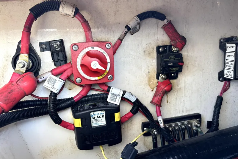 Slide: The Image of Electrical wiring and components inside a 2022 Boston Whaler 250 Dauntless boat. - 40