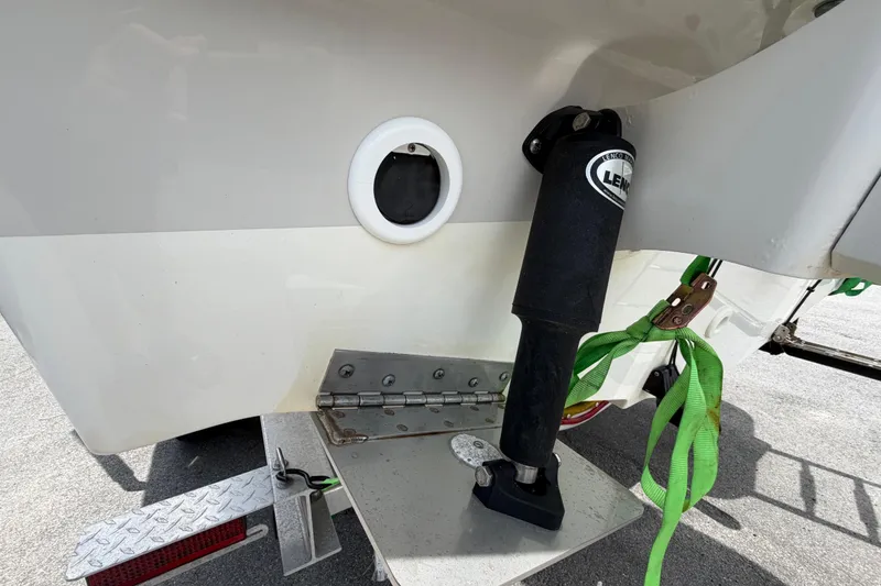 Slide: The Image of 2022 Boston Whaler 250 Dauntless boat with Lenco trim tab and green strap. - 6