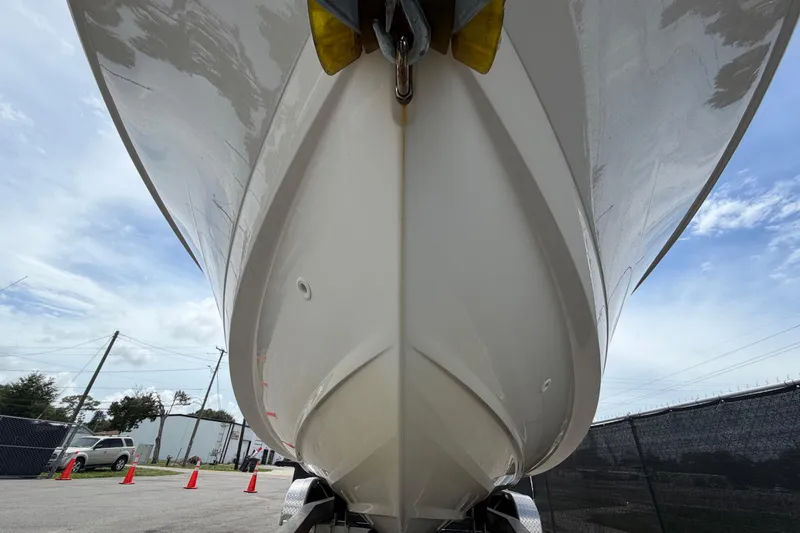 Slide: The Image of 2022 Boston Whaler 250 Dauntless boat hull viewed from below, outdoors. - 11