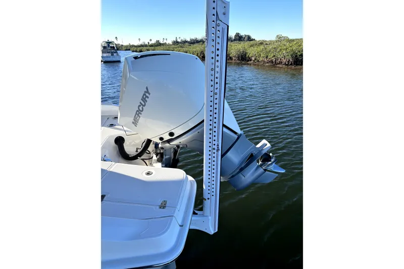 Slide: The Image of 2022 Boston Whaler 250 Dauntless with Mercury outboard motor on calm water. - 37