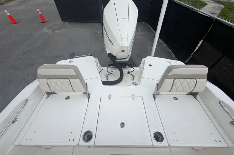 Slide: The Image of 2022 Boston Whaler 250 Dauntless boat with Mercury engine, rear seating view. - 54