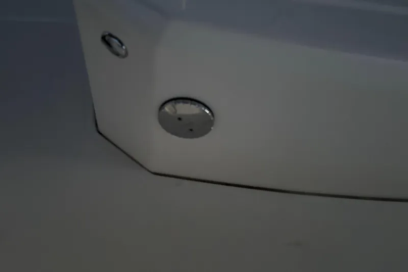 Slide: The Image of Close-up of 2022 Boston Whaler 250 Dauntless boat hull with chrome fittings. - 44
