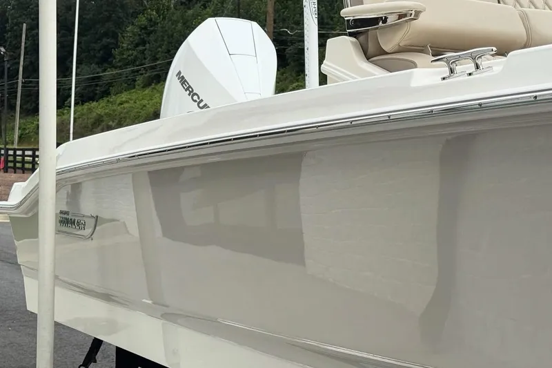 Slide: The Image of 2022 Boston Whaler 250 Dauntless boat with Mercury engine, side view. - 5
