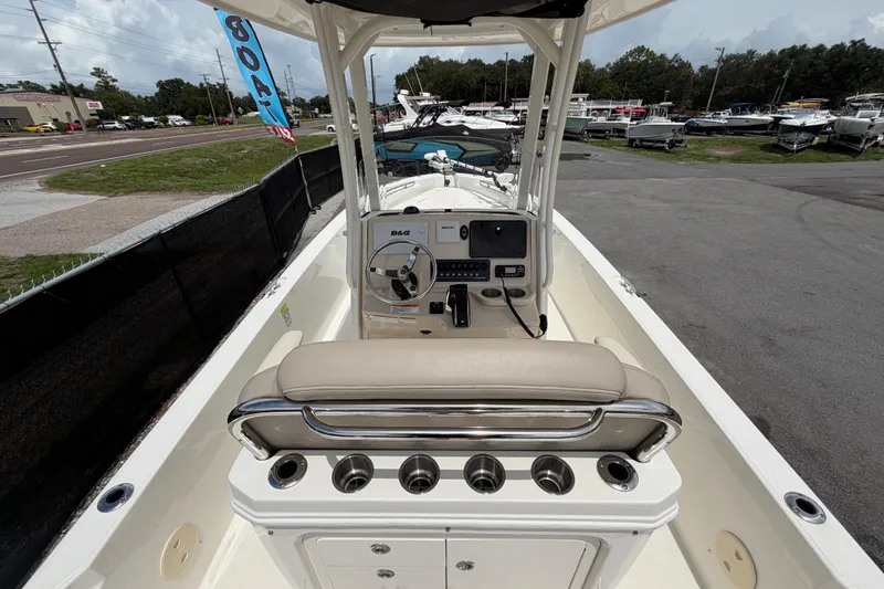 Slide: The Image of 2022 Boston Whaler 250 Dauntless boat interior with steering console and seating. - 17