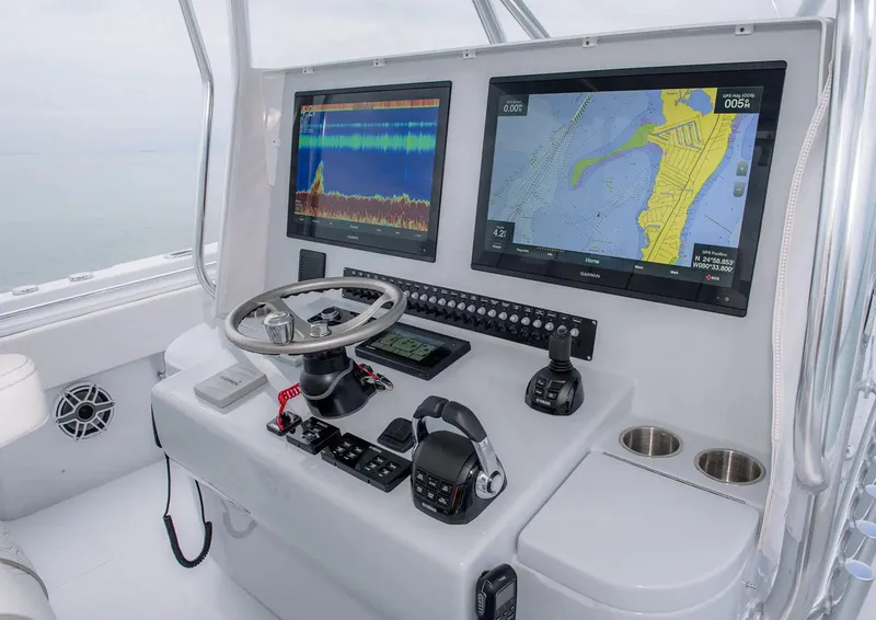 Slide: The Image of Manufacturer Provided Image: Contender 44 CB 2026 helm with dual navigation screens. - 8
