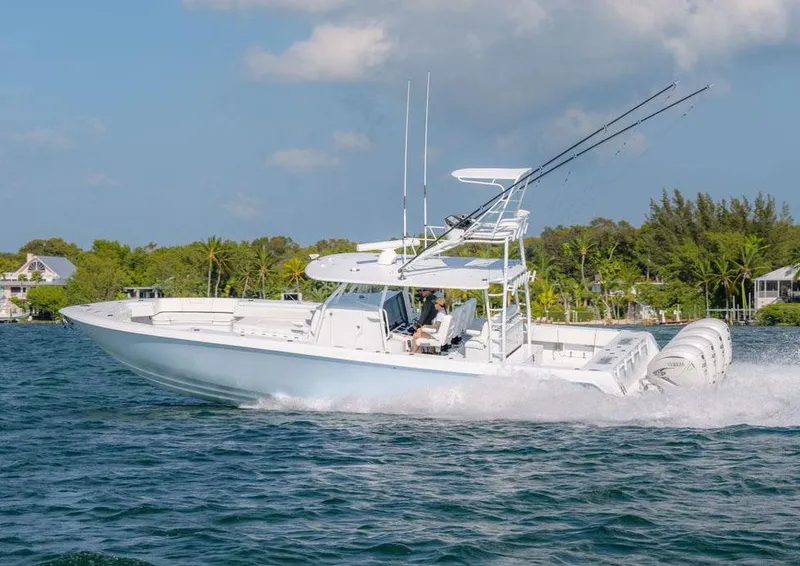 Slide: The Image of Manufacturer Provided Image: 2026 Contender 44 CB boat cruising on water - 3