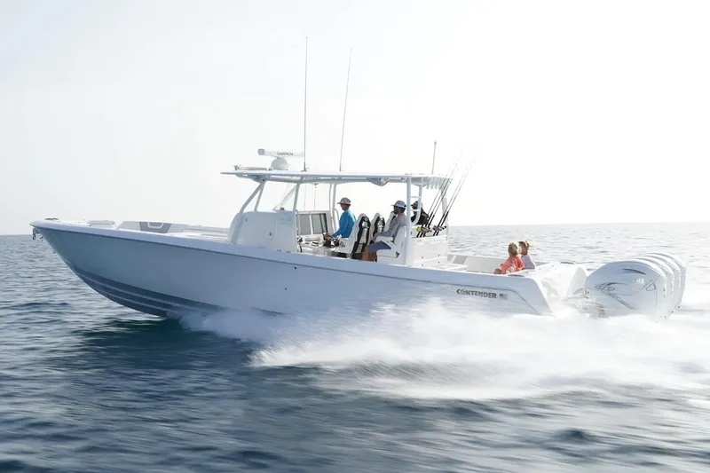 The Image of Manufacturer Provided Image: 2026 Contender 44 CB boat cruising on open water, showcasing sleek design and powerful engines. - 1