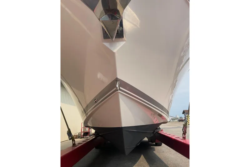 Slide: The Image of 2018 Pursuit DC 325 Dual Console boat on trailer, front view. - 22