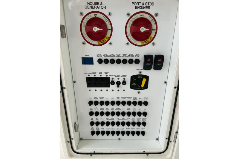 Slide: The Image of Electrical control panel of a 2018 Pursuit DC 325 Dual Console boat. - 17