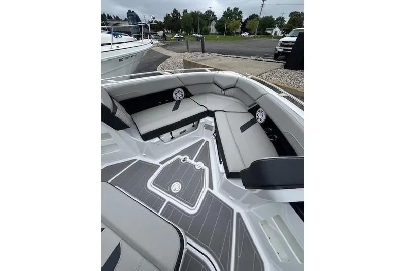 Slide: The Image of 2027 Monterey Elite 30 OB boat interior with sleek seating and modern design. - 19