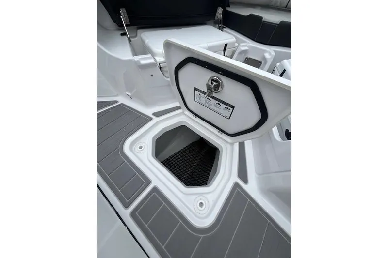 Slide: The Image of Open storage compartment on 2027 Monterey Elite 30 OB boat deck. - 17