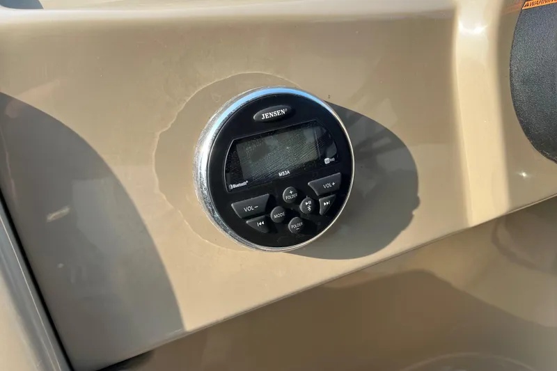 Slide: The Image of Jensen audio system on 2019 SunChaser Geneva Cruise 20 LR boat dashboard. - 9
