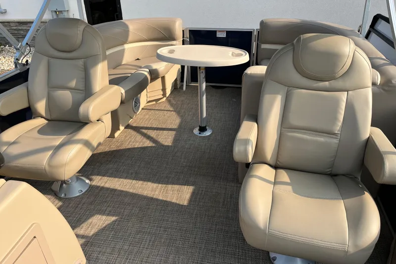 Slide: The Image of 2019 SunChaser Geneva Cruise 20 LR interior with beige seating and round table. - 7