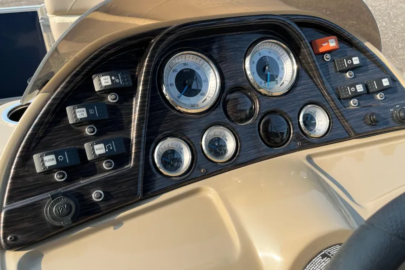 Slide: The Image of Dashboard of 2019 SunChaser Geneva Cruise 20 LR boat with gauges and controls. - 10