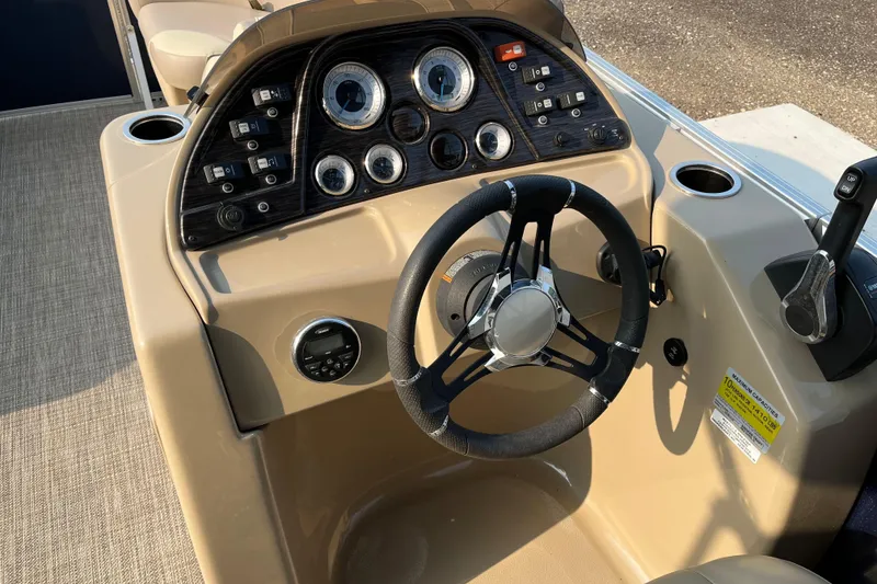 Slide: The Image of 2019 SunChaser Geneva Cruise 20 LR boat dashboard with steering wheel and control panel. - 8