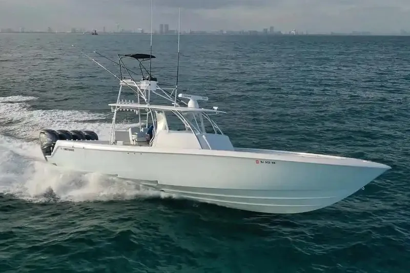 The Image of Manufacturer Provided Image: 2026 Contender 44 Fisharound boat cruising on open water. - 1