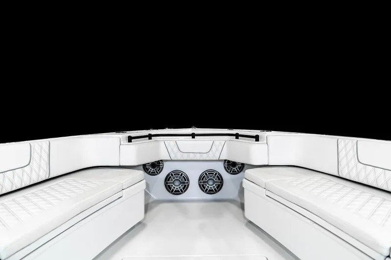 Slide: The Image of Manufacturer Provided Image: 2026 Contender 44 Fisharound boat interior with white seating and built-in speakers. - 5