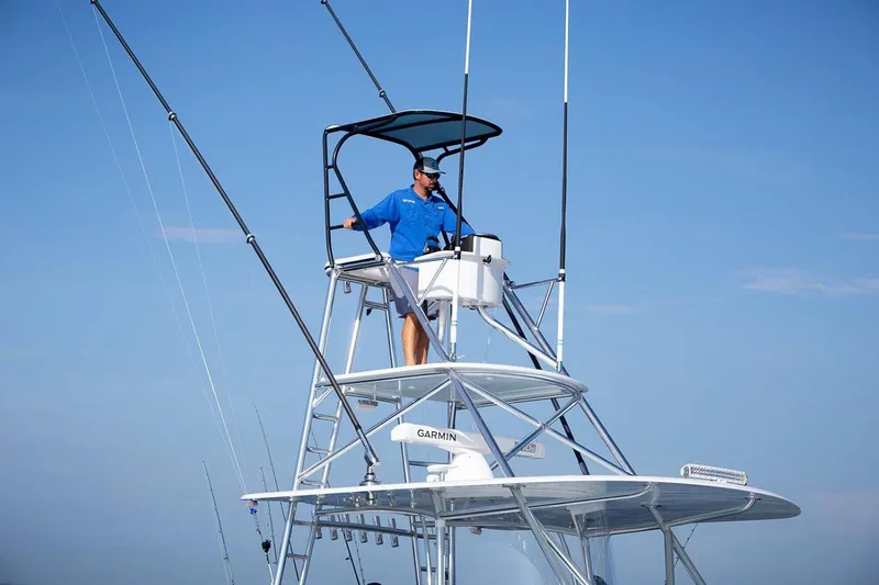 Slide: The Image of Manufacturer Provided Image: Man on Contender 44 ST boat tower, 2026 model. - 10
