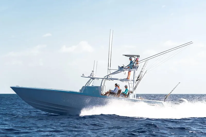 Slide: The Image of Manufacturer Provided Image: 2026 Contender 44 ST boat cruising on open ocean with passengers onboard. - 2