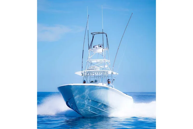 Slide: The Image of Manufacturer Provided Image: 2026 Contender 44 ST boat cruising on open water. - 6
