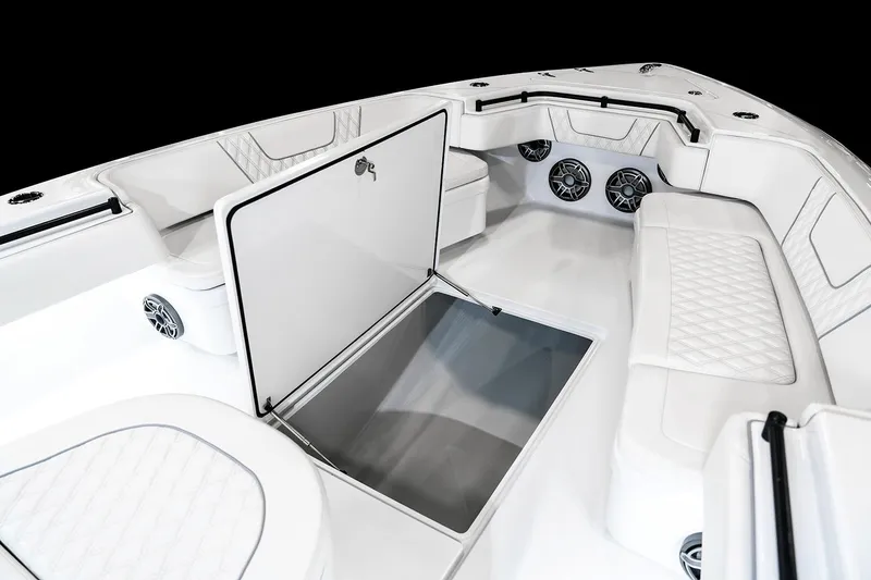 Slide: The Image of Manufacturer Provided Image: 2026 Contender 44 ST boat interior with open storage, white seating, and speakers. - 11