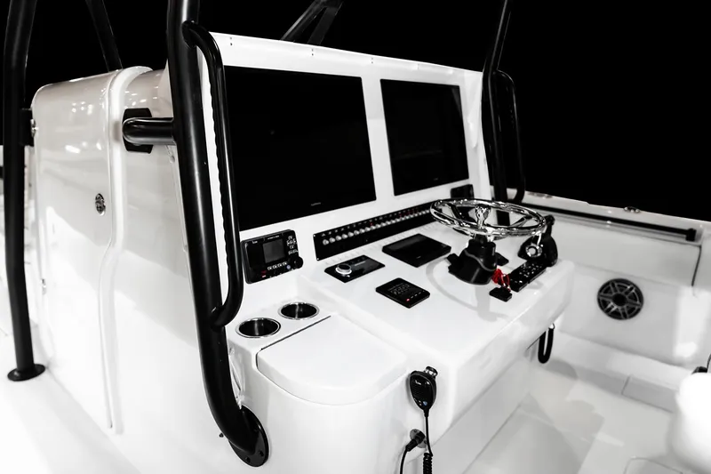 Slide: The Image of Manufacturer Provided Image: 2026 Contender 44 ST boat console with dual screens and steering wheel. - 13