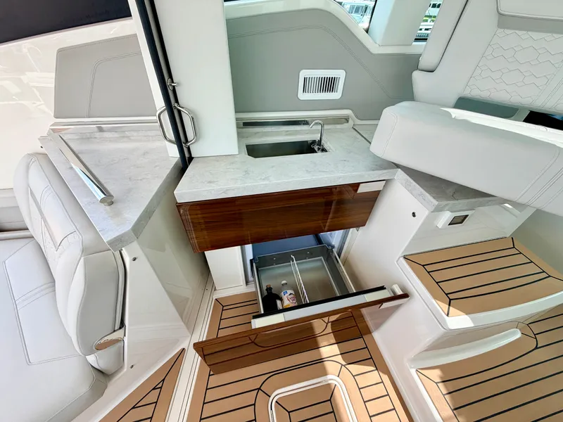 Slide: The Image of The 2022 Tiara Yachts 43 LE features an elegant interior with wood and marble details. - 14