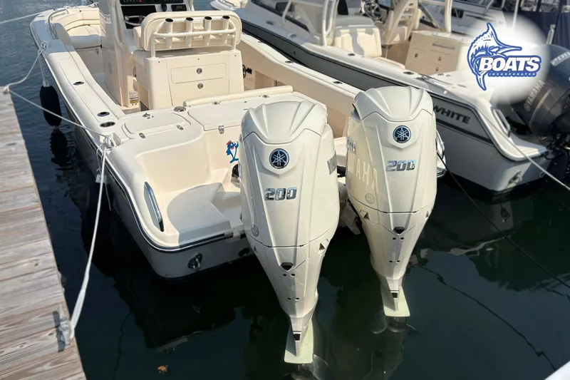 Slide: The Image of 2024 Grady-White Fisherman 257 boat with twin Yamaha 200 engines docked at marina. - 14