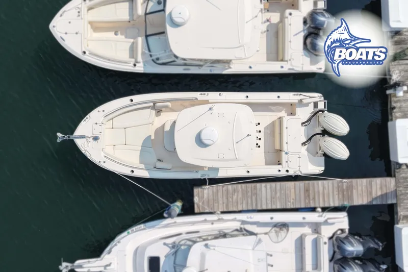 Slide: The Image of Overhead view of a 2024 Grady-White Fisherman 257 boat docked at a marina. - 15