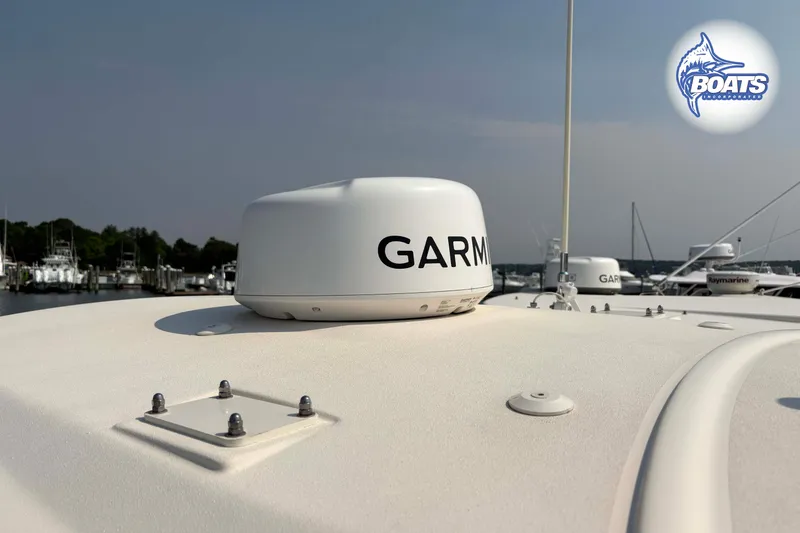 Slide: The Image of 2024 Grady-White Fisherman 257 boat with Garmin radar, docked at marina. - 12