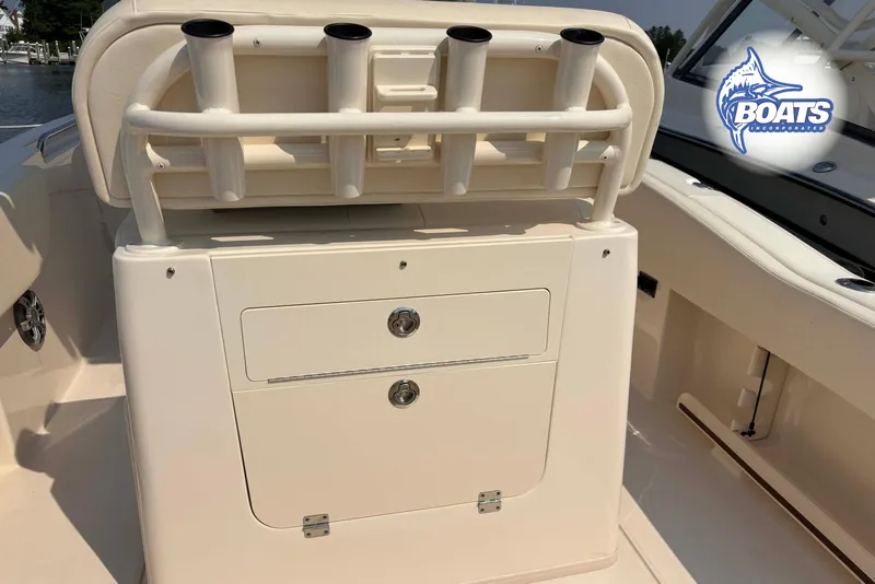 Slide: The Image of 2024 Grady-White Fisherman 257 boat interior with rod holders and storage compartments. - 10