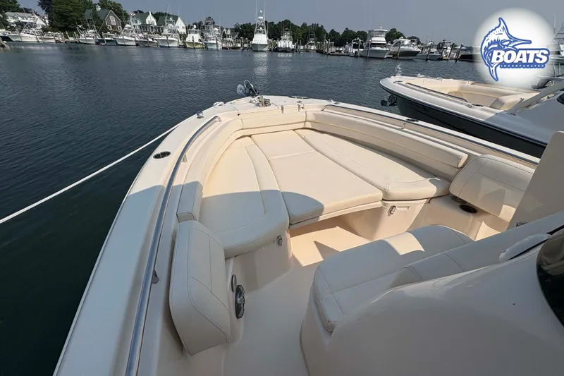 Slide: The Image of 2024 Grady-White Fisherman 257 boat interior with spacious seating, docked in a marina. - 6