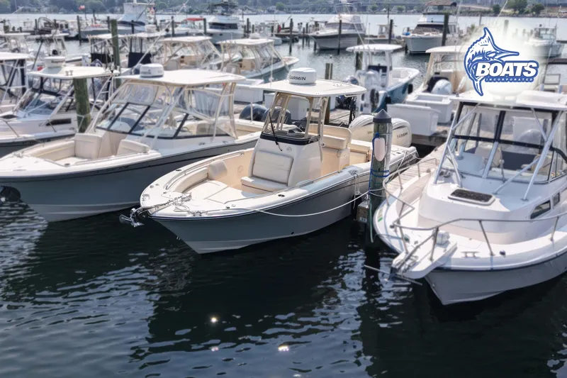 The Image of 2024 Grady-White Fisherman 257 boat docked among other vessels in a marina. - 0