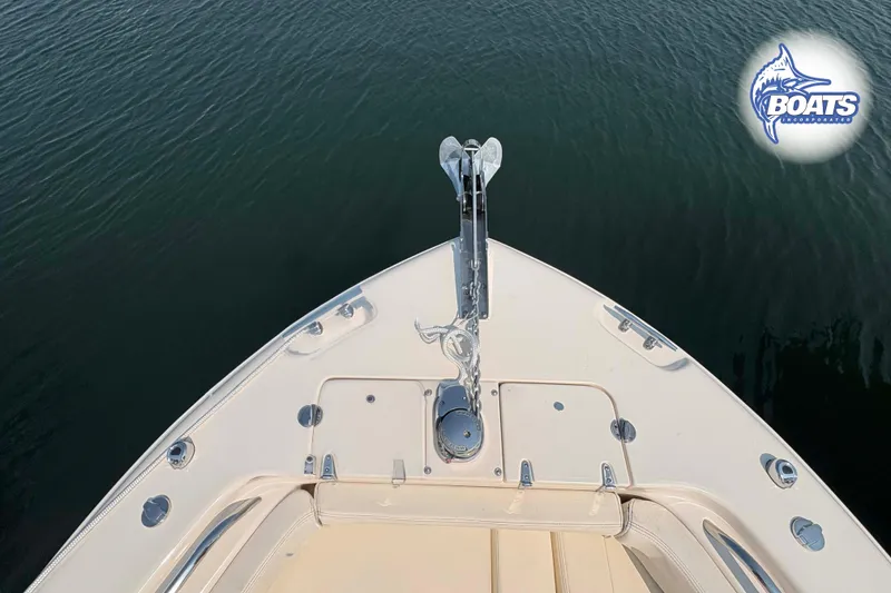 Slide: The Image of Bow view of 2024 Grady-White Fisherman 257 boat on calm water. - 4