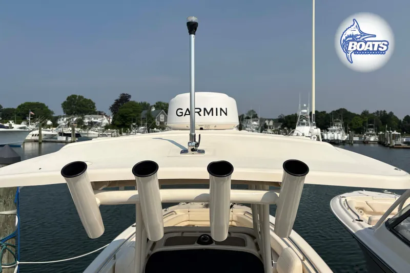 Slide: The Image of 2024 Grady-White Fisherman 257 boat with Garmin equipment, docked in a marina. - 11