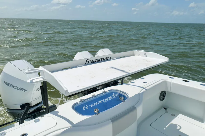 Slide: The Image of 2024 Freeman 38 boat with Mercury engines on open water. - 21