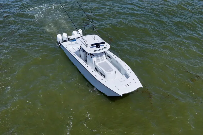 Slide: The Image of 2024 Freeman 38 boat cruising on open water, aerial view. - 44