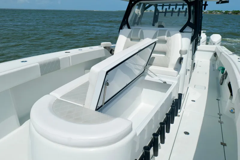 Slide: The Image of 2024 Freeman 38 boat interior with open storage compartment on a sunny day. - 40