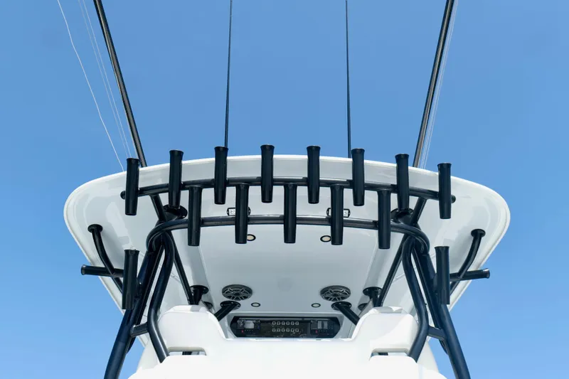 Slide: The Image of 2024 Freeman 38 boat tower with rod holders against clear blue sky. - 31