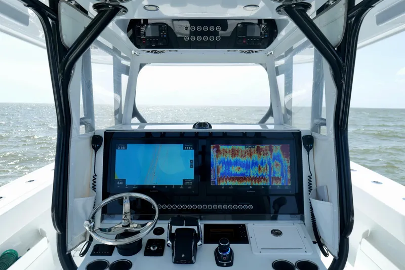 Slide: The Image of Cockpit view of 2024 Freeman 38 boat with advanced navigation displays. - 13
