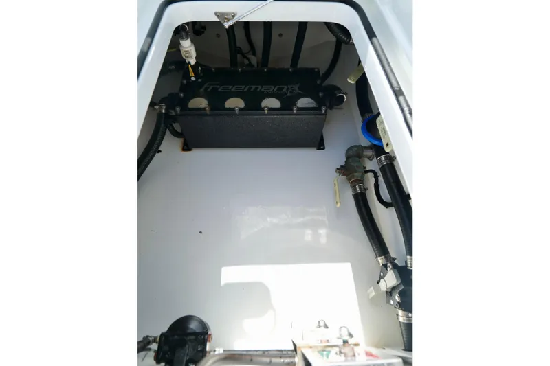 Slide: The Image of Engine compartment of 2024 Freeman 38 boat, showcasing internal components and wiring. - 25