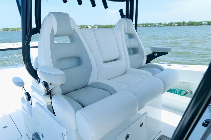 Slide: The Image of Luxurious seating on a 2024 Freeman 38 boat, featuring plush white upholstery and ergonomic design. - 15