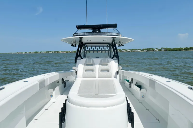 Slide: The Image of 2024 Freeman 38 boat on open water, showcasing sleek design and spacious seating. - 42