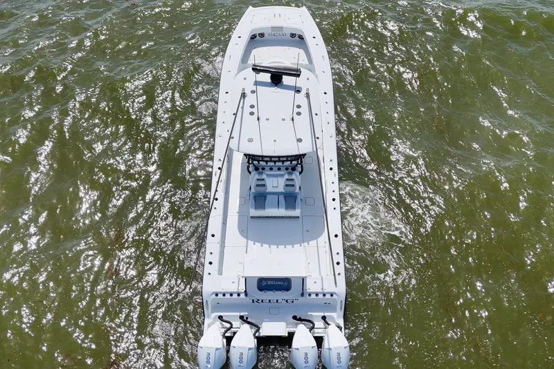 Slide: The Image of Aerial view of 2024 Freeman 38 boat on water, showcasing sleek design and triple engines. - 45