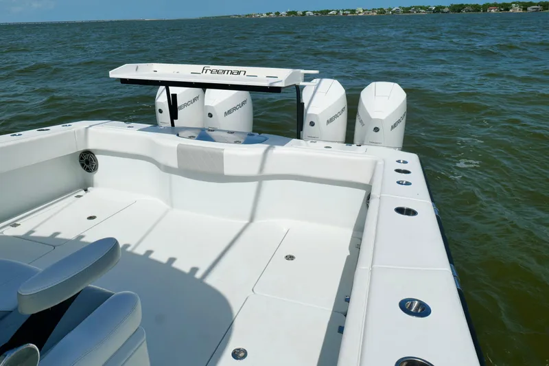 Slide: The Image of 2024 Freeman 38 boat with Mercury engines on open water. - 20